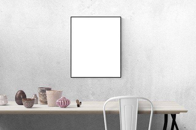 A white framed picture on a white wall

Description automatically generated with low confidence